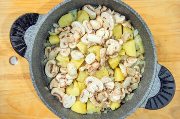 Raw ingredients. Ready to be cooked. Recipe for chiken stew, European cuisine, cooked with a garnish of mushrooms, small onions and ohter.