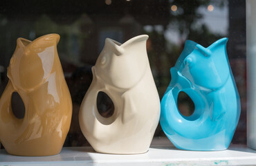 decorative water pitchers in a shop window
