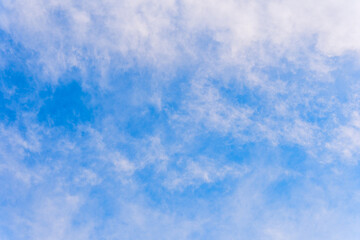 Natural blue sky with white puffy clouds, creative background.