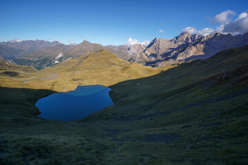 Beautiful mountain lake Lac des Especieres ou de Luhos in the Pyrenees on a sunny autumn day,...