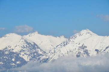 Fototapeta na wymiar Snowy winter landscape of a ski resort,panoramic view