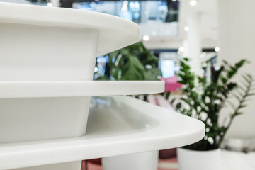 Detail of a reception desk made of white synthetic material