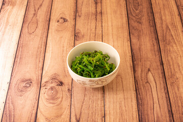 Wakame is an edible seaweed. In Japan it is used in the preparation of miso soup