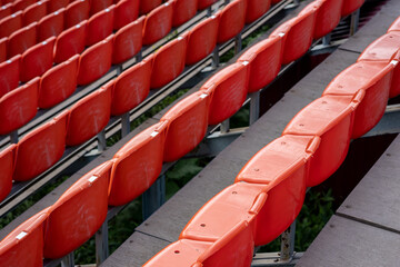 Obraz premium top view of the rows of seats in the stadium, orange seats for spectators