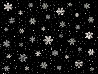 Christmas background with snowflakes. Snowflakes on black background. Falling snow background. Snowflakes in the night sky 