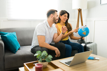 Excited couple preparing to travel on vacations