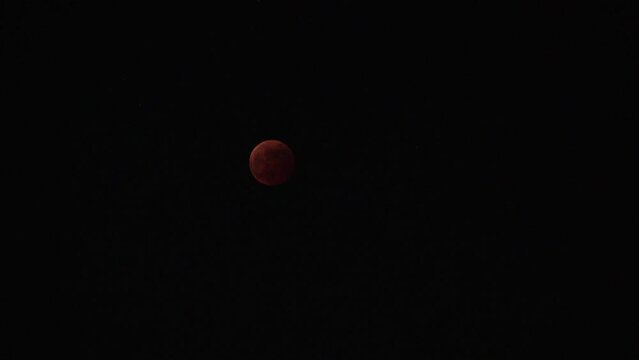 FUKUOKA, JAPAN - 8 NOVEMBER 2022 : A total lunar eclipse coinciding with a lunar occultation of Uranus, in which the planet is eclipsed by the moon. Such an occurrence hadn&rsquo;t been seen in 442 years.