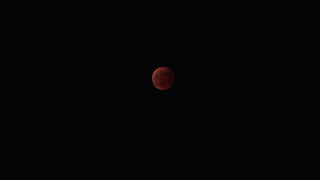FUKUOKA, JAPAN - 8 NOVEMBER 2022 : A total lunar eclipse coinciding with a lunar occultation of Uranus, in which the planet is eclipsed by the moon. Such an occurrence hadn&rsquo;t been seen in 442 years.