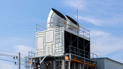 Cooling towers in data center building. Air conditioning cooling towers in front of building with...