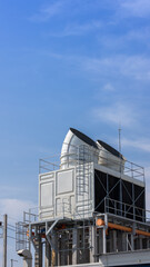 Cooling towers in data center building. Air conditioning cooling towers in front of building with...