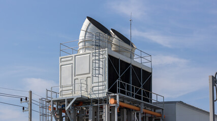 Cooling towers in data center building. Air conditioning cooling towers in front of building with...