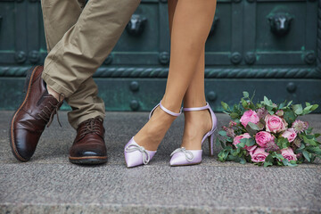 Newlyweds legs that standing the same. Wedding