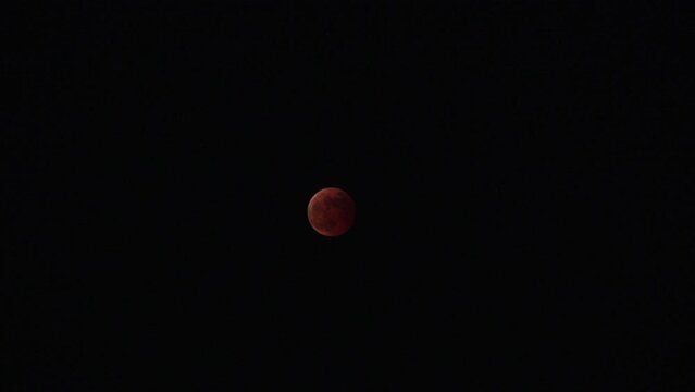 FUKUOKA, JAPAN - 8 NOVEMBER 2022 : A total lunar eclipse coinciding with a lunar occultation of Uranus, in which the planet is eclipsed by the moon. Such an occurrence hadn&rsquo;t been seen in 442 years.