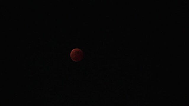 FUKUOKA, JAPAN - 8 NOVEMBER 2022 : A total lunar eclipse coinciding with a lunar occultation of Uranus, in which the planet is eclipsed by the moon. Such an occurrence hadn&rsquo;t been seen in 442 years.