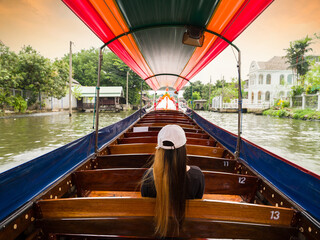 Tourist woman on Chao Phraya river boat trip. Bangkok, Thailand. The most important activity of...