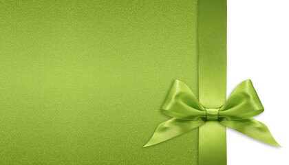 Green bright ribbon bow isolated on glitter background, top view copy space for gift greeting card, Merry Christmas, St Patrick or father day banner or valentine present