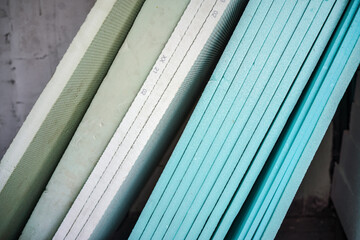 Foam polystyrene insulation boards ready for installation at new house construction, closeup detail