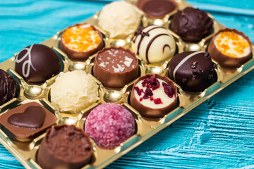 Chocolate prailne candies with nuts and dried fruits