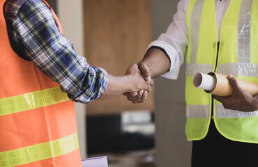 Construction contractors shaking hand.