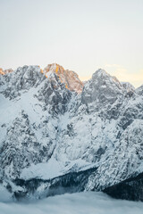 Fototapeta na wymiar snow covered mountains in winter at sunset 