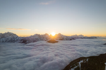 sunrise in the mountains and clouds at winter