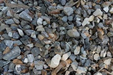 Mass quantity of multiple granite stones isolated over the stone background