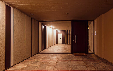 A modern residential building's entrance night view, Athens, Greece. Less is more..