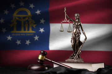 Georgia US state flag with statue of lady justice, constitution and judge hammer on black drapery....