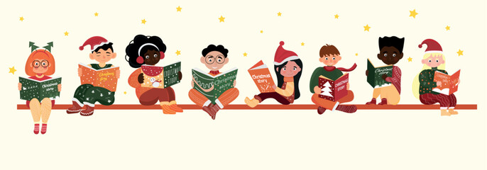 Group of little children in winter clothes reading Christmas story on light background