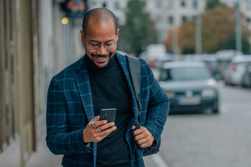 businessman with mobile phone in the street