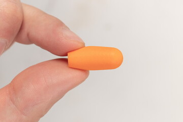 Silicone ear plugs for human ears on white background