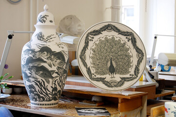 Authentic porcelain production in the Porcelain Manufactory Meissen - ceramic vase and plate with...