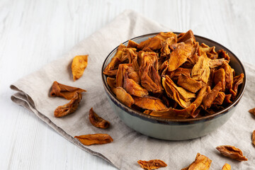 Delicious Organic Dried Mango Fruit in a Bowl, side view.