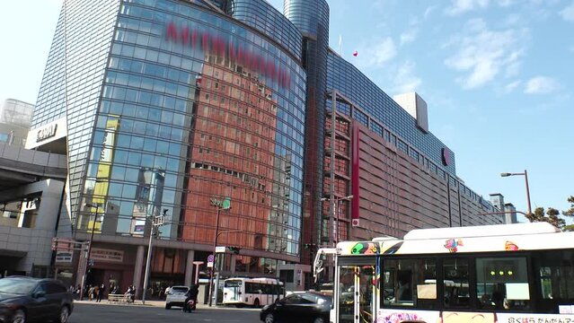 FUKUOKA, JAPAN - NOVEMBER 2022 : View around TENJIN area in Fukuoka city. Nishitetsu Fukuoka, Tenjin station and department stores. Busy downtown shopping area. Time lapse shot in daytime.
