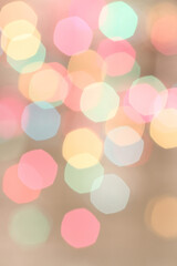 Blurred colored lights on light beige background