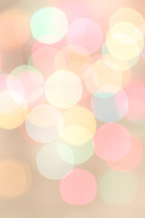 Blurred colored lights on light beige background