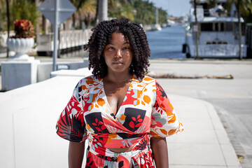 Natural Black Woman basking in the sun enjoying the water.