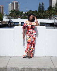Natural Black Woman basking in the sun enjoying the water.