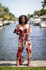Natural Black Woman basking in the sun enjoying the water.