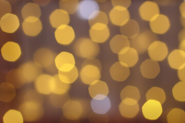 Blurred yellow and white lights on brown background