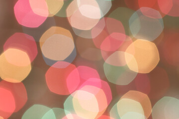 Blurred colored lights on light beige background