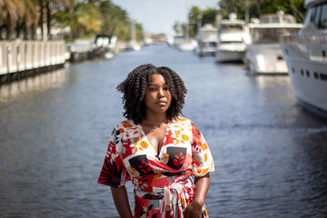 Natural Black Woman basking in the sun enjoying the water.