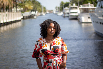 Natural Black Woman basking in the sun enjoying the water.
