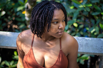 Natural Black woman enjoying her walk in a nature park