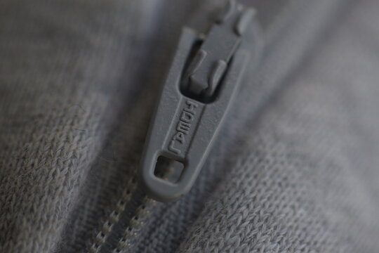 Close-up Texture Of The Material Of The Tracksuit Brand Adidas Gray Color