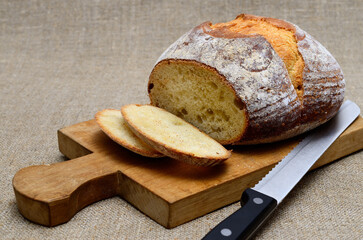 Fresh bread on a cutting board. Bakery products close up