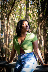 Natural Black woman enjoying her walk in a nature park