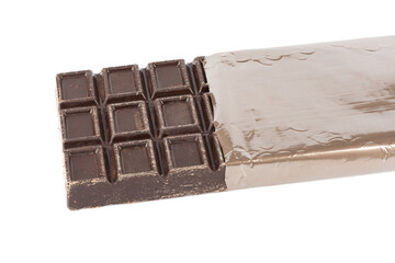 Whole bar of chocolate partially wrapped isolated on white background.