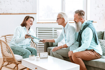 Fototapeta premium elderly couple beautiful man and `senior woman in office or cabinet of gerontologist psychologist doctor, geriatric for the elderly, active longevity