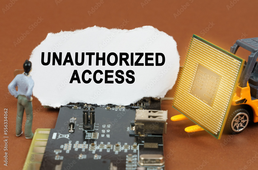 Poster on the board with microcircuits lies a paper plate with the inscription - unauthorized access